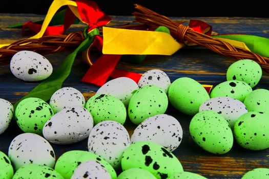 Easter eggs on wooden background. Czech concept. Colour ribbons and Easter theme. 