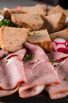 Assortment of meat delicatessen on a plate