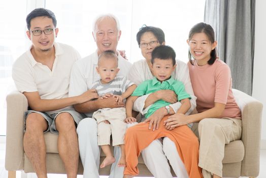 Portrait of happy Asian family at home, multi generations indoor lifestyle.