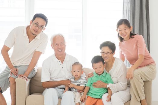 Happy Asian family at home, portrait of multi generations indoor lifestyle.