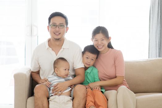 Happy Asian family at home, portrait of parents and children indoor lifestyle.