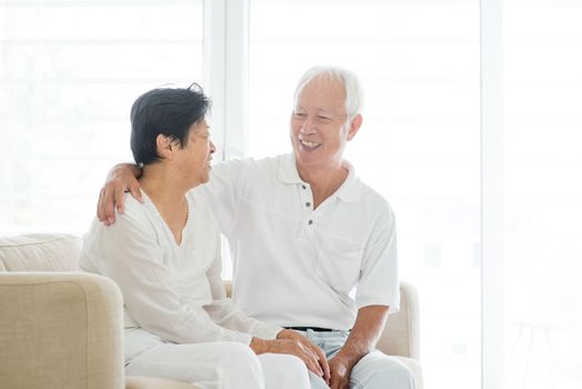 Portrait of Asian elderly couple talking at home, old senior retired people indoor lifestyle.