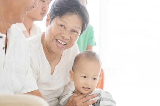 Happy Asian family at home, multi generations people indoor lifestyle.