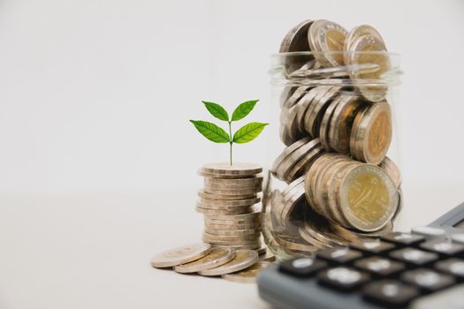 Stock financial indices with stack coin and calculator. Financial stock market in accounting market economy analysis.