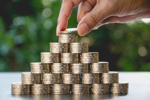 Saving money concept with money coin stack growing for business. financial and accounting concept.