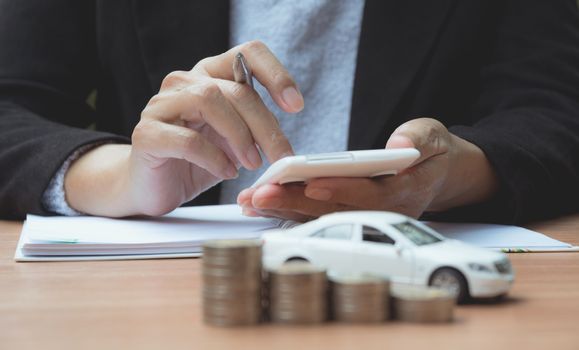 Businessman with car insurance and car services. Car insurance and financial concept.