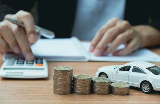 Businessman with car insurance and car services. Car insurance and financial concept.