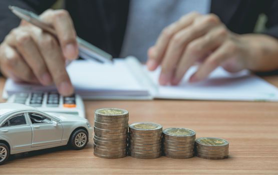 Businessman with car insurance and car services. Car insurance and financial concept.
