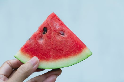 Woman holding watermelon. Portrait woman is holding slice of watermelon.