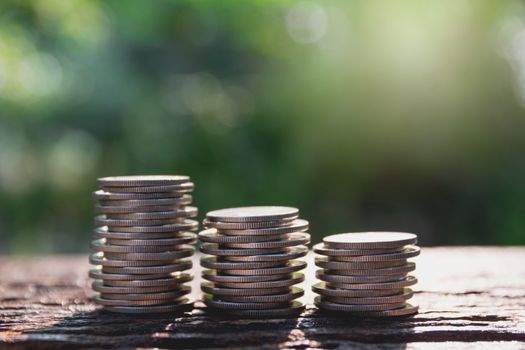 Saving money concept with  money coin stack growing for business and accounting concept.