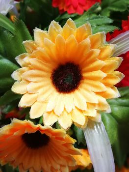 multi color of plastic flowers for decorations on office table