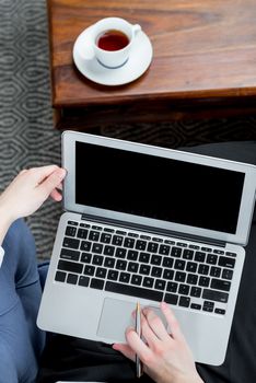 businesswoman and laptop, female hands close-up while working