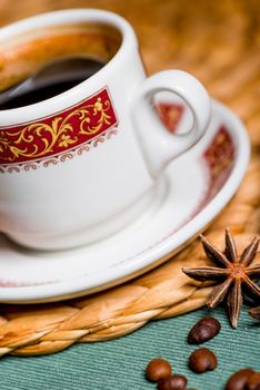 cup with a pattern with coffee and anise