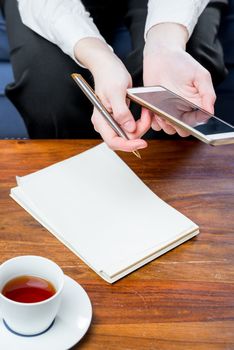 notebook on the table and a businesswoman sitting next