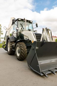 New road-construction equipment outdoors on the exhibition