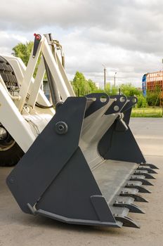New road-construction equipment outdoors on the exhibition