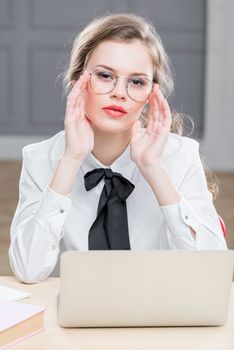 vertical portrait of businesswoman wearing glasses