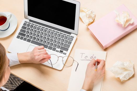 girl at work in the office view of the desk top