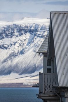 Detail Of A Traditional House On The Waterfront In Reykjavik Iceland With A View Of The Mountains Across The Bay