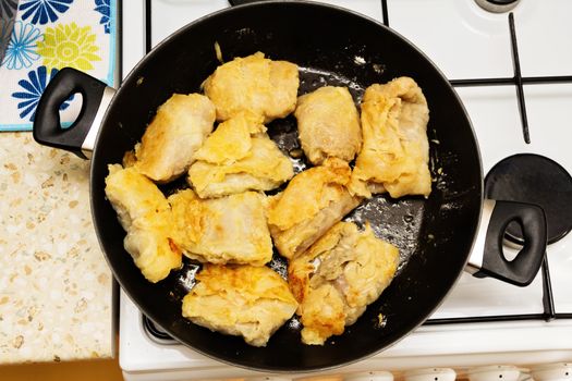 Fried in margarine in a frying pan stuffed with meat and cabbage.