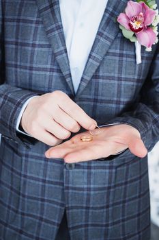 Close-up of elegance man hands with ring, and cufflink