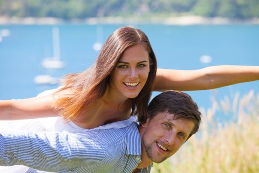 Happy smiling couple on vacation flying together