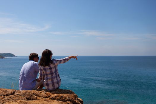 Young couple enjoy beautiful sea view on vacation