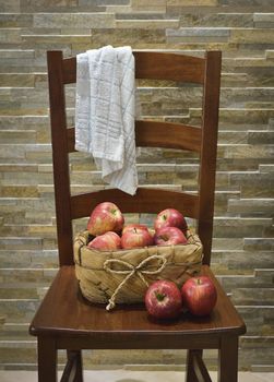 Vintage chair with a basket of apples