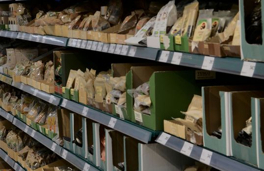 Blurred nuts section at retail store in Europe.  Aisle in local supermarket, defocused background.