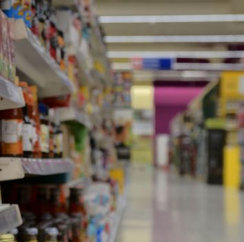 Blurred section at retail store in Europe.  Aisle in local supermarket, defocused background.