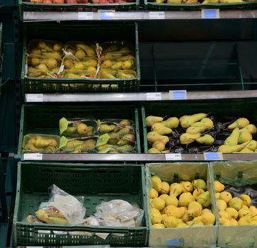 Greengrocery section at retail store in Europe. Greengrocery - pears in local supermarket.