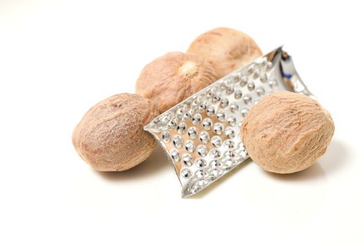 Nutmeg whole and powder isolated on white background