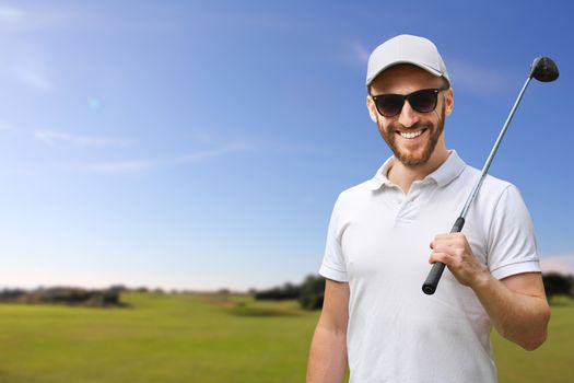 Portrait of male golfer with golf club at course