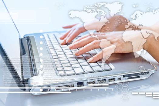 communication concept. Business woman typing on the keyboard of his laptop