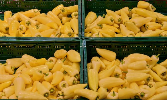 Greengrocery section - peppers, paprika at retail store in Europe. Greengrocery in local supermarket.