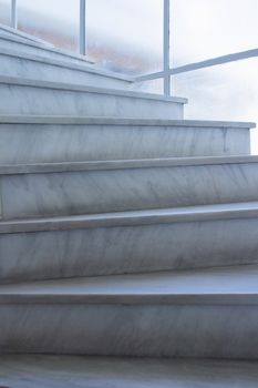 View of geometrical pattern background of light gray stone marble stairs