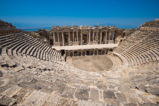 Roman amphitheatre in the ruins of Hierapolis, in Pamukkale, near modern turkey city Denizli, Turkey.