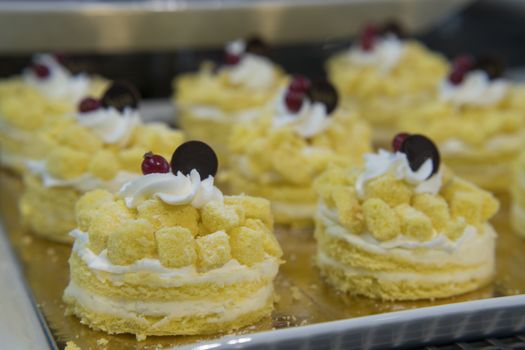 Lemon pastry with butter cream, selective focus, close up.