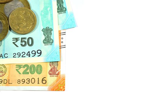 New Indian 50 and 200 rupees with 10 rupees coin on white isolated background.