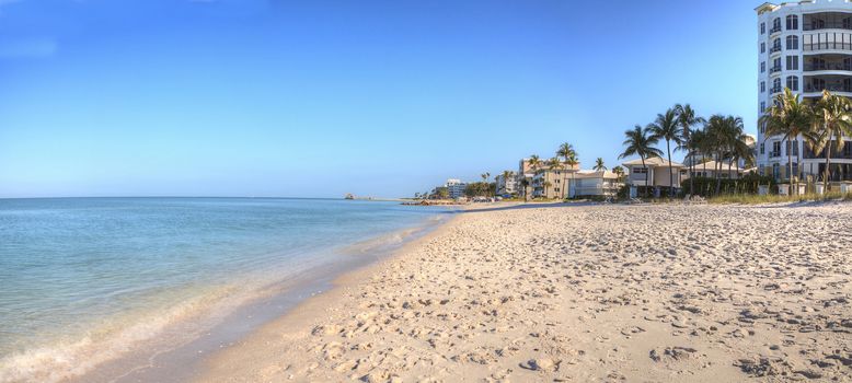 Clear blue sky over Lowdermilk Beach in Naples, Florida