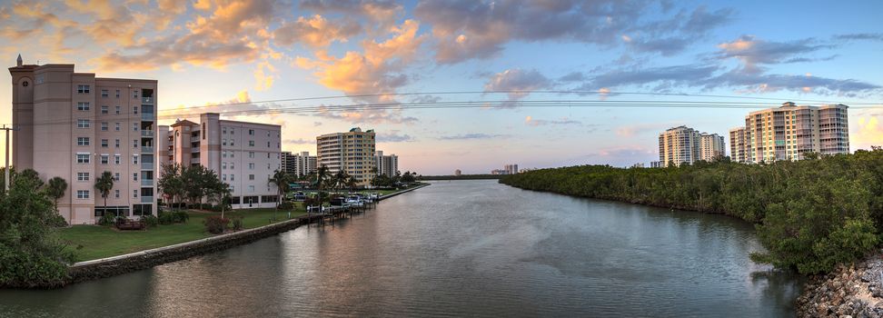 Sunset sky and clouds over the Vanderbilt Channel river near Delnor-Wiggins Pass State Park and Wiggins Pass in Naples, Florida