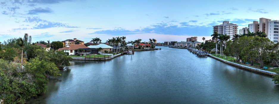 Sunset sky and clouds over the Vanderbilt Channel river near Delnor-Wiggins Pass State Park and Wiggins Pass in Naples, Florida