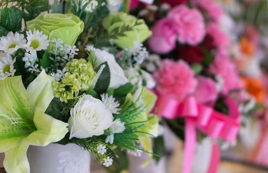 Closeup beautiful flowers in white jug happy feeling concept