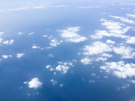 Top view sky and clouds looking from window airplane, nature background concept