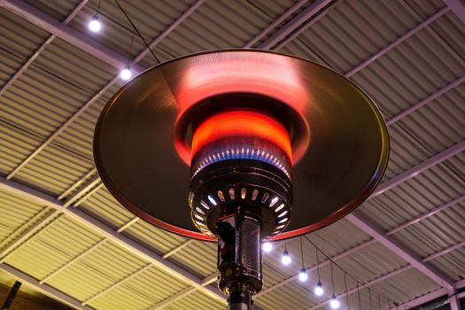 Gas terrace heater or patio heater under high roof