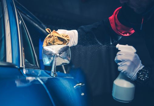 Blue American Classic Car Detailing Cleaning by Professional Worker.