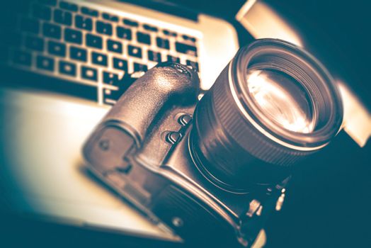 Modern Digital Photography Equipment. Camera and the Computer For Post Processing.