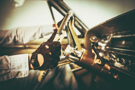 Vintage RIder. American Classic Car Interior. Caucasian Men in Leather Gloves on the Road Trip.