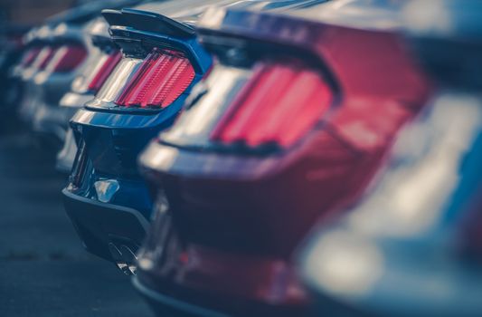 Modern Cars in Dealer Stock. Vehicles Dealership. Row of Cars Closeup Photo. Automotive and Transportation Theme.