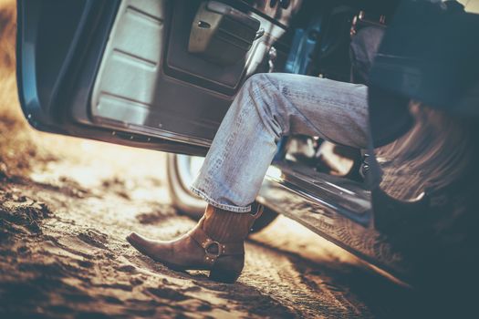 Cowboy and the Classic Muscle Car Taking a Ride. Cowboy Shoes. Leather Boot.